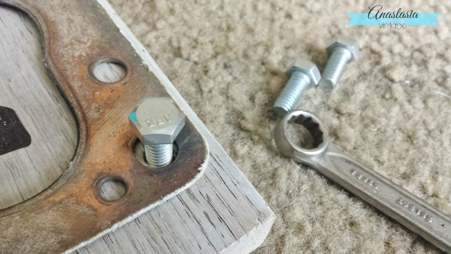 securing gasket to scrap wood with bolts repurposed fall decor