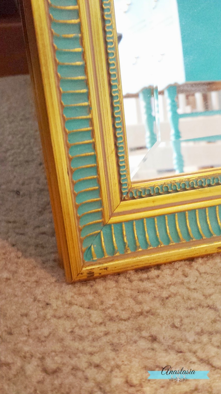 teal & gold mirror close up