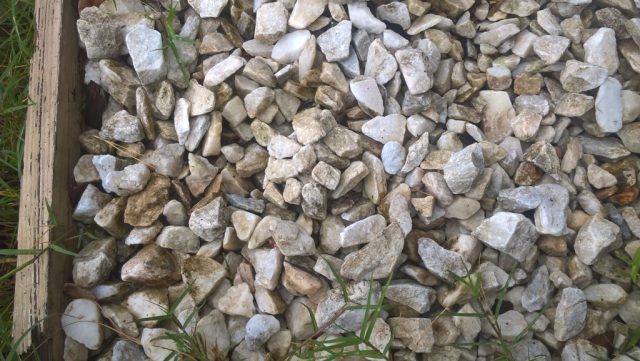 rock bottle buried in rocks